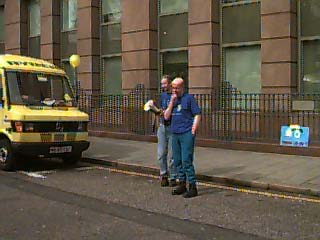 Alastair Scott's speech: Erol Ziya holds the (useless) megaphone